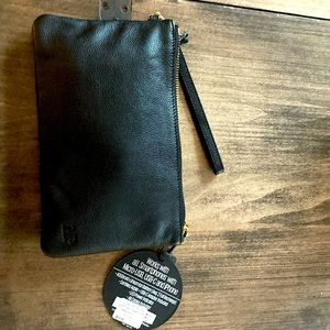 H butler black leather clutch w/built in iPhone charger. Tags still on.